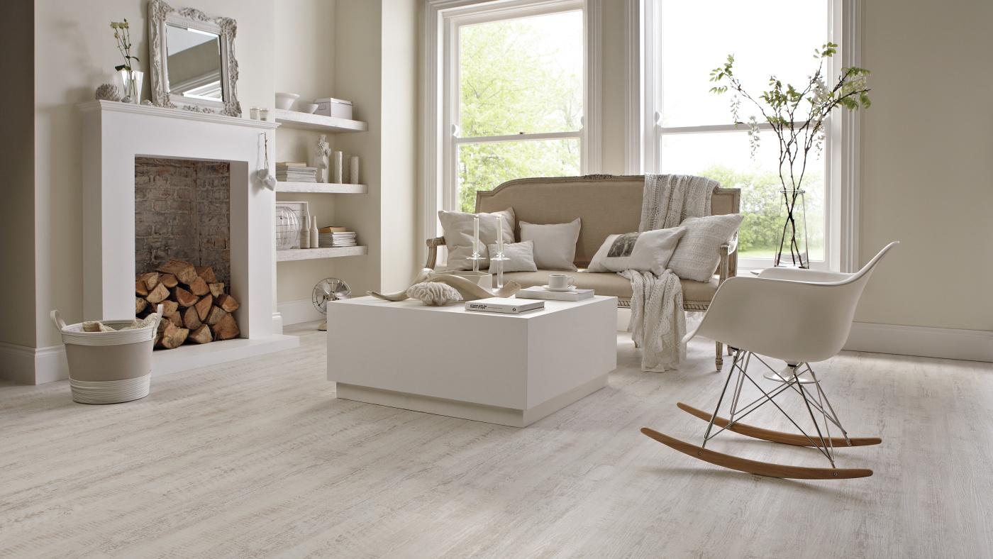 These stripped down, chalky white painted planks feature hints of the natural wood, creating an authentic coastal feel without the upkeep of natural hardwood. Bedroom with Knight Tile SCB-KP105-6