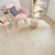 Van Gogh Blush Oak mid brown LVT flooring in a reading corner