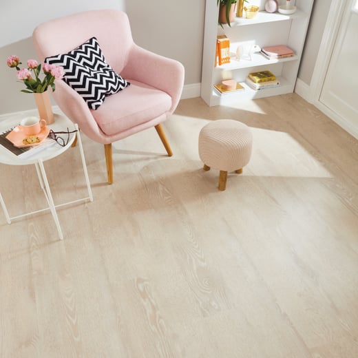 Van Gogh Blush Oak mid brown LVT flooring in a reading corner