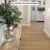 Natural Prime Oak VGW115T in a narrow hallway with green plants